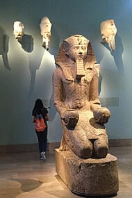 Girl in museum with Egyptian art