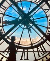 Girl by clock at Orsay Museum