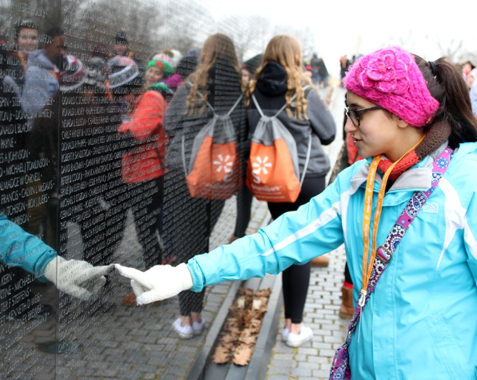Girl pointing at Vietnam Veterans Memorial